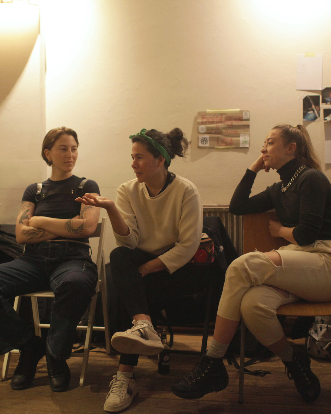 A person explains their point while two other people listen